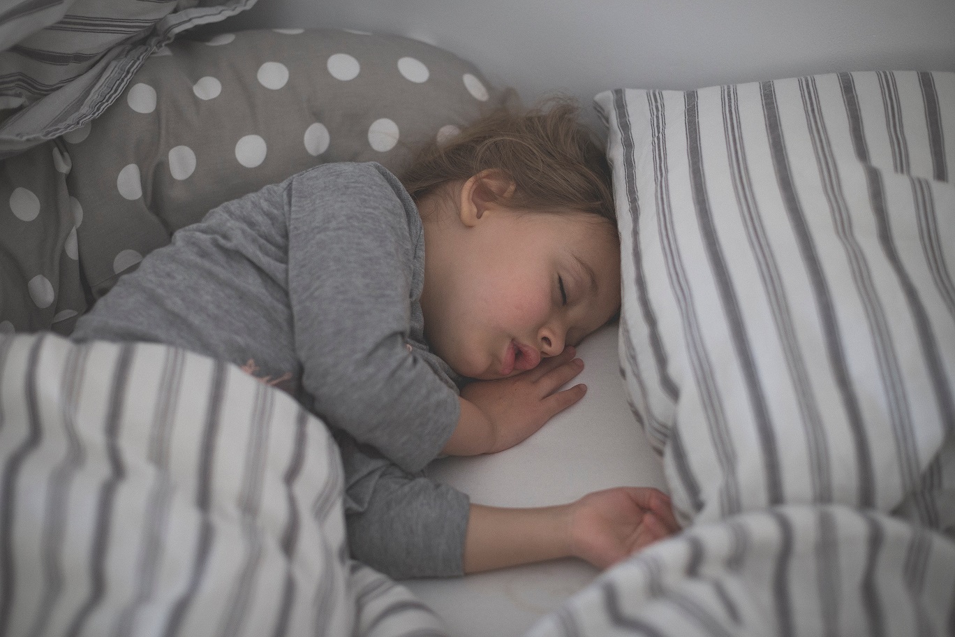 Sleeping child in an article by Dr. Nancy Musarra on can your child have a seizure in their sleep?